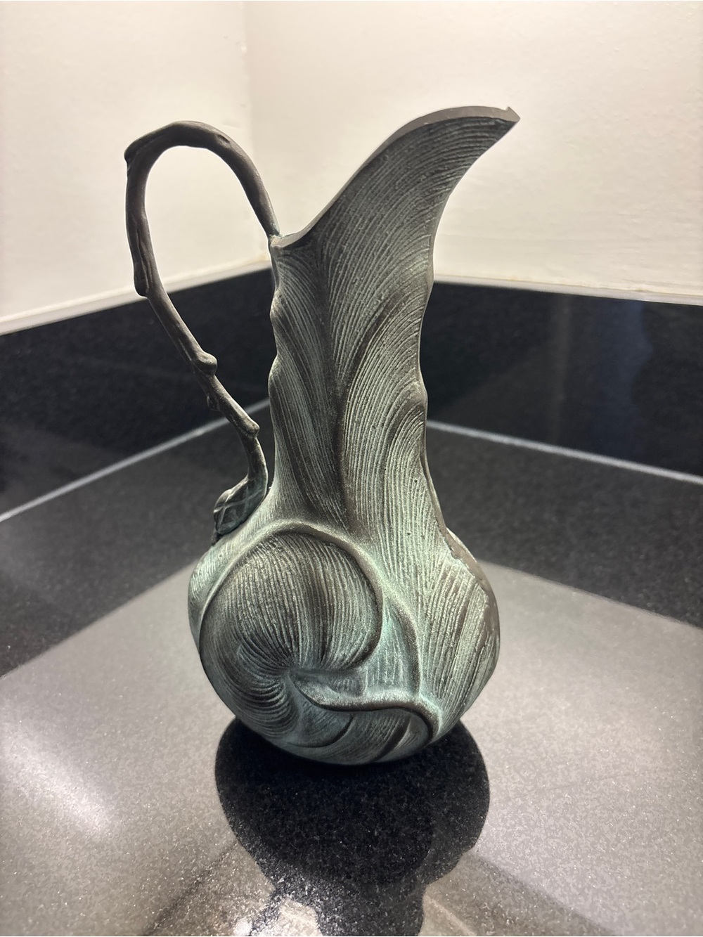 Leafy brass pitcher